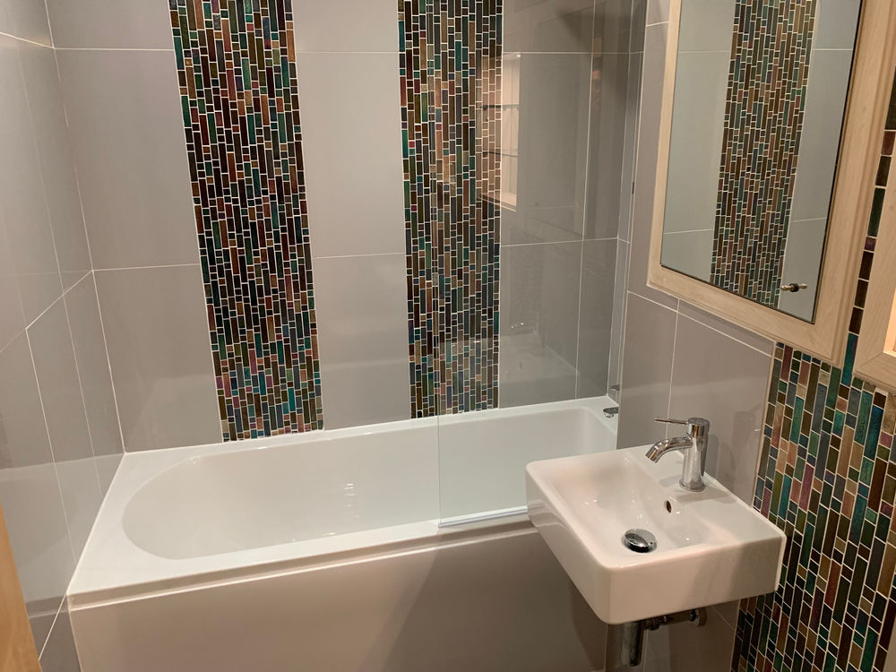 Finished family bathroom with mosaic tile detail