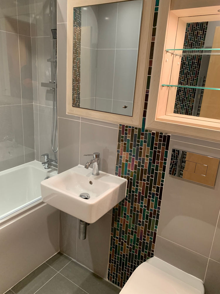 Modern basin and tiled bathroom finish