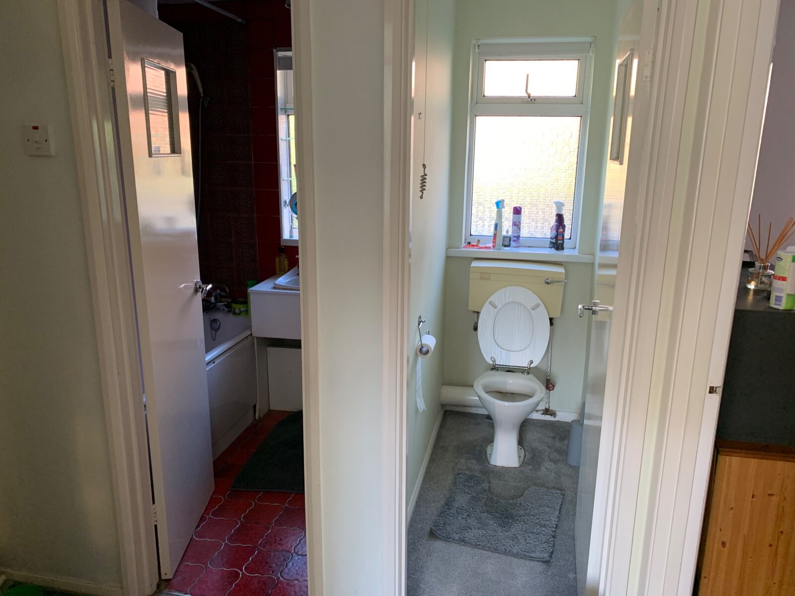 Completed larger bathroom with grey wall and floor tiles