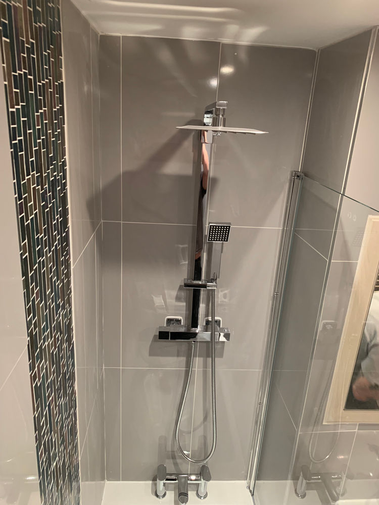 New shower installation with chrome controls