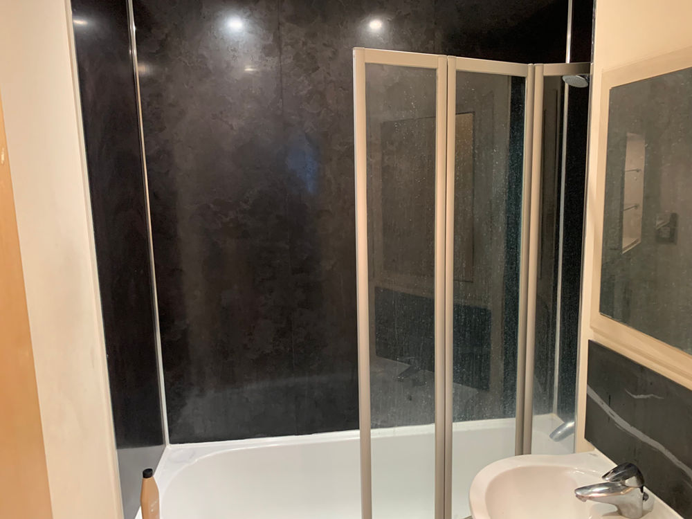 Shower enclosure and tray installation