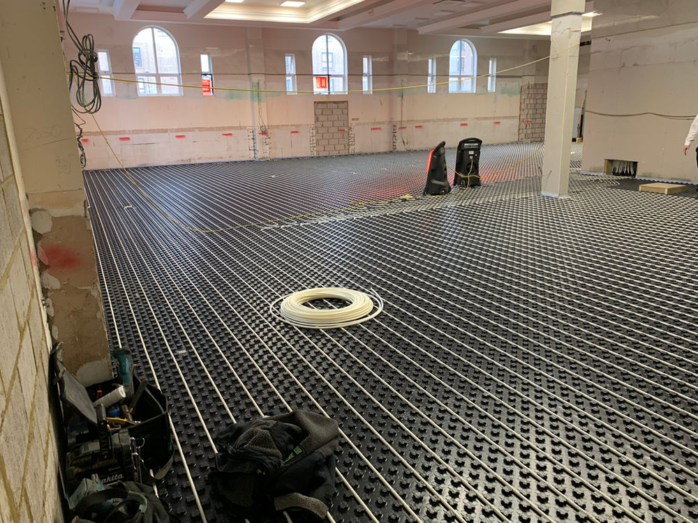 Underfloor heating installed around floor features